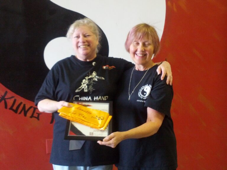 Receiving my Yellow Sash from Shifu Carla
